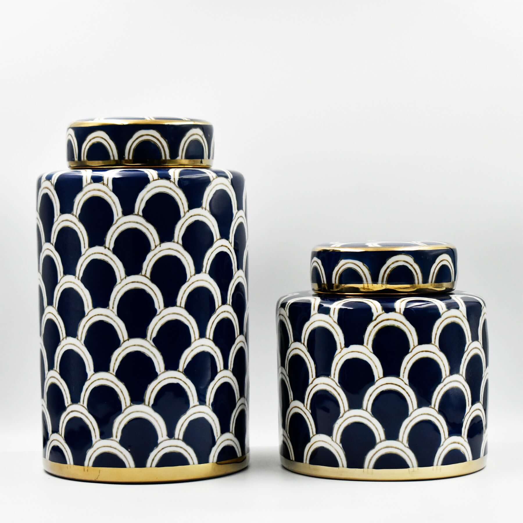 The exquisite Azurean Scallop Ceramic Jar Set is captivating statement home decor and fine ceramic home accents. From Luxury Co, these decorative jars offer impactful interior styling and enhance home ambiance. Perfect as navy and gold scallop ceramic jar