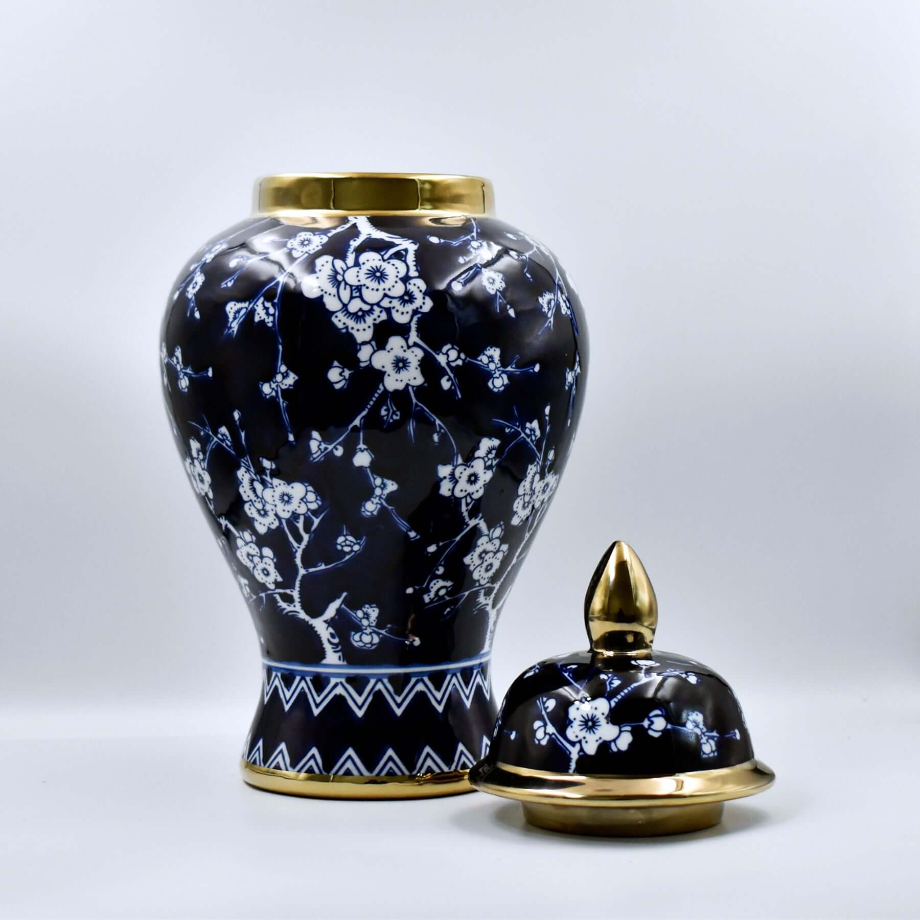 Decorative urn with floral patterns on a white background