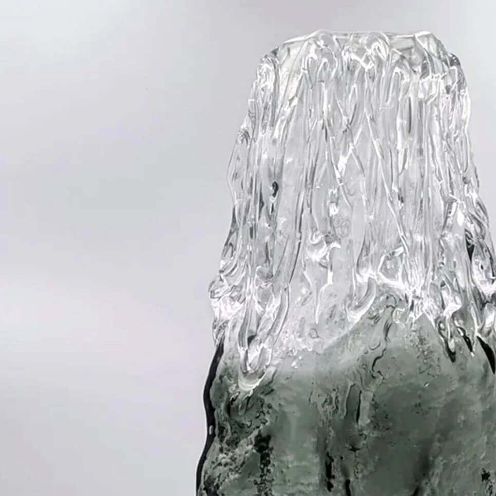 Hand blown smoked glass vase with unique rook texture, showcasing modern artisanal design.