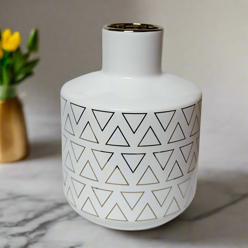 Ceramic Vase in White & Gold – Modern Minimalist Accent, 20cmElevate your home with this stylish Ceramic Vase in White & Gold, featuring premium ceramic design with polished gold accents for a modern touch.