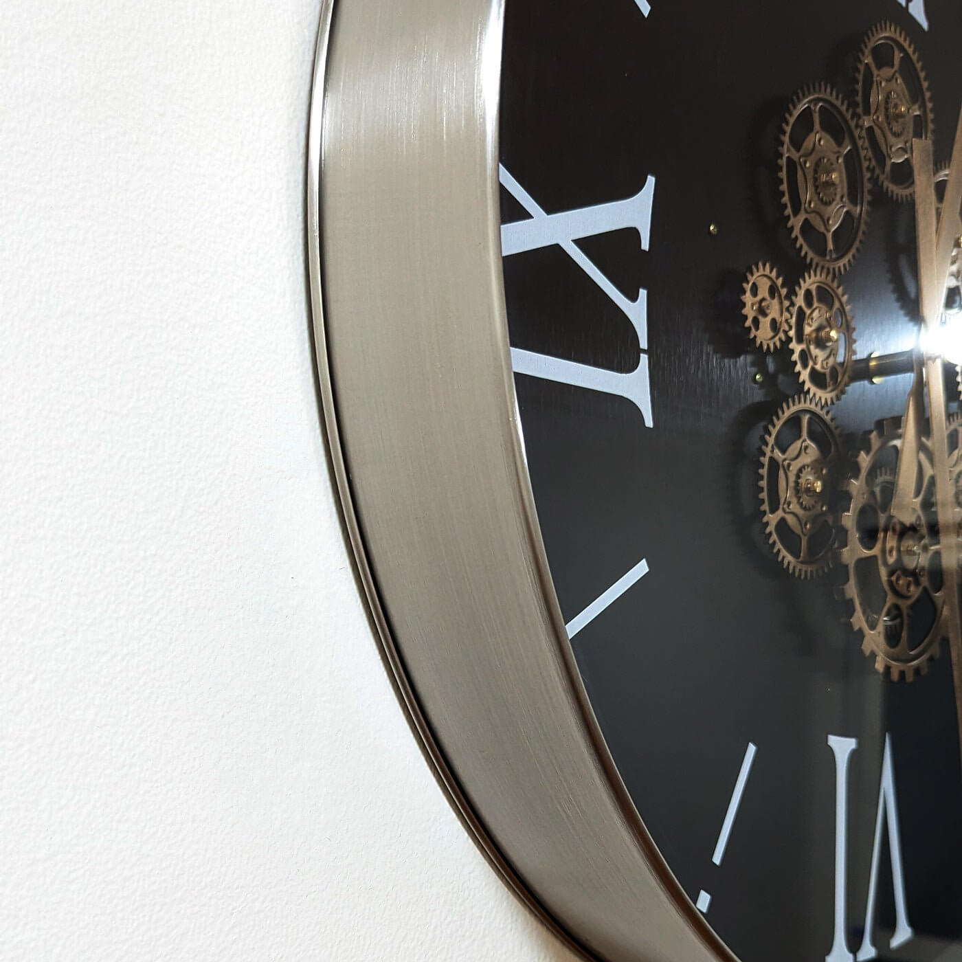 SOFI Modern Round Wall Clock with Exposed Gears, 60cmElevate your decor with SOFI's 60cm wall clock, featuring exposed gears & Roman numerals for industrial luxury.