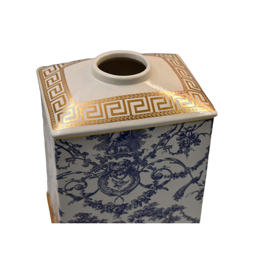 Decorative ceramic container with blue floral pattern and gold accents on a white background