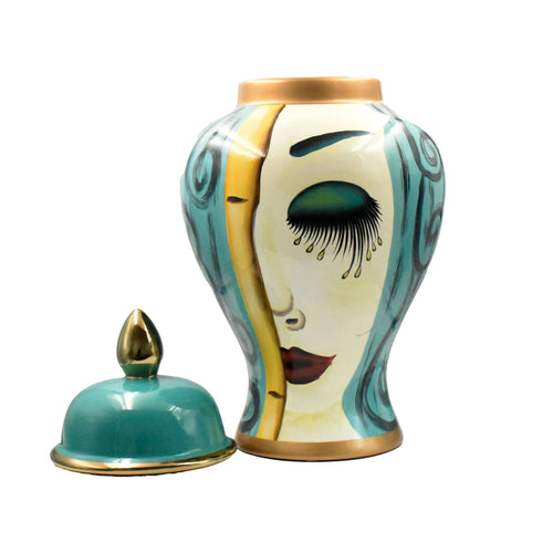 Elevate your interior styling with the Isabella Medium Face Jar, a captivating piece of unique tabletop decor. This exquisite art deco ceramic jar for shelf styling, from Luxury Co, is a unique work of art bringing luxury and personality to your home. Cra