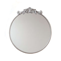 Elevate your space with the Baroque Silver Round Mirror. This 60x60 cm decorative wall mirror features a stunningly ornate silver frame, showcasing classic Baroque style influence. It adds vintage charm and sophistication, perfect as a silver accent mirro