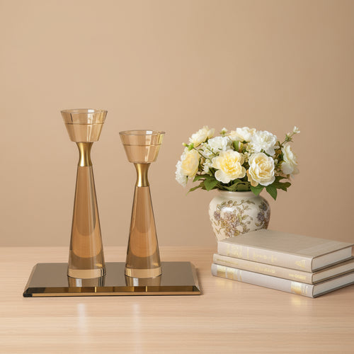 Refined Crystal & Bronze Candle Holder Set on wooden table with floral vase and books