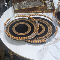 Modern black and gold Greek key serving tray set with beaded handles, perfect for adding sophistication to any home decor.