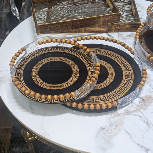 Black & Gold Greek Key Glass Tray Set with beaded handles on a marble table.