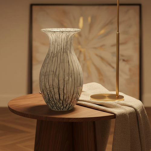 gray marble vases on a light surface with a textured white and gold background
