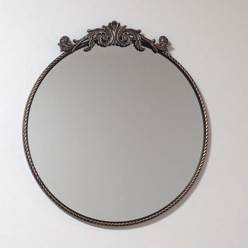 Elevate your space with this Ornate Baroque Round Wall Mirror. Featuring a detailed aged gold frame and intricate motifs, this 60cm circular mirror exudes vintage European elegance and antique charm. Perfect as a decorative accent or statement piece in li